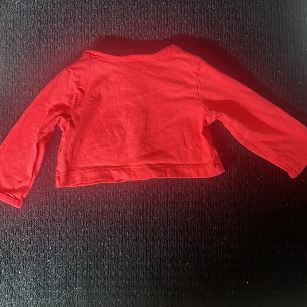 Carter’s size 3 months red long sleeve top. So cute!